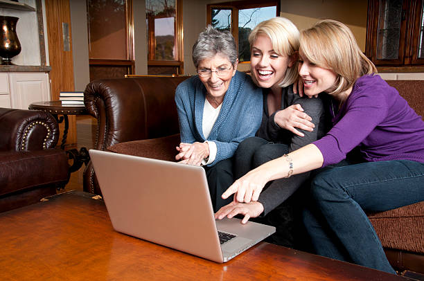 Three Generations of Women On Social Network stock photo