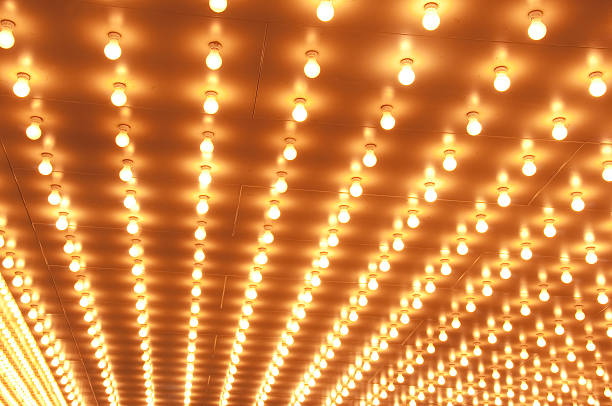 istock Rows of brightly lit theater marquee lights 184339226