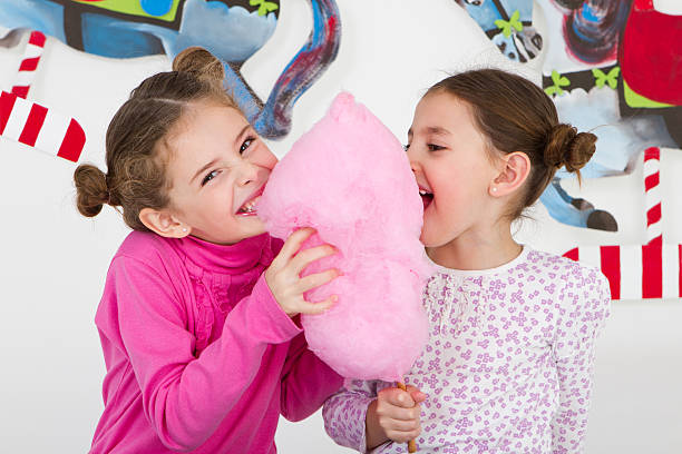 Happy friends having fun at amusement park - studio shot