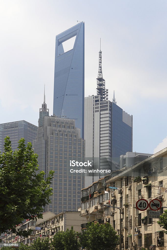 New and Old Buildings in Shanghai "New office building and old residential buildings in Shanghai, China." Apartment Stock Photo