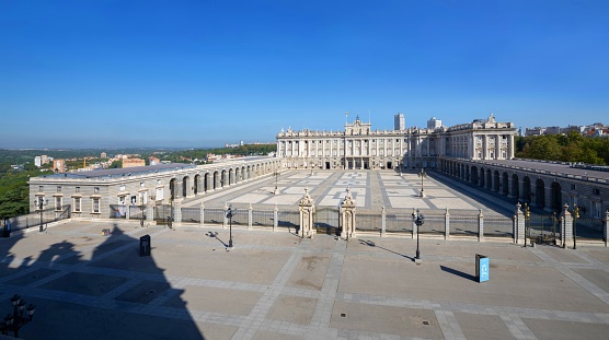 Madrid, Spain - January 2, 2011: The Royal Palace Palacio Real in Madrid, Spain. Photo taken during the day from the square in front, and contains tourists and locals walking about.