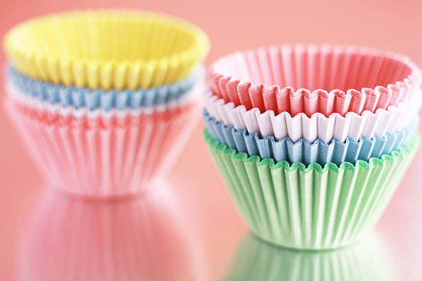 istock Cupcake liners in pastel tones with pink background 184339747