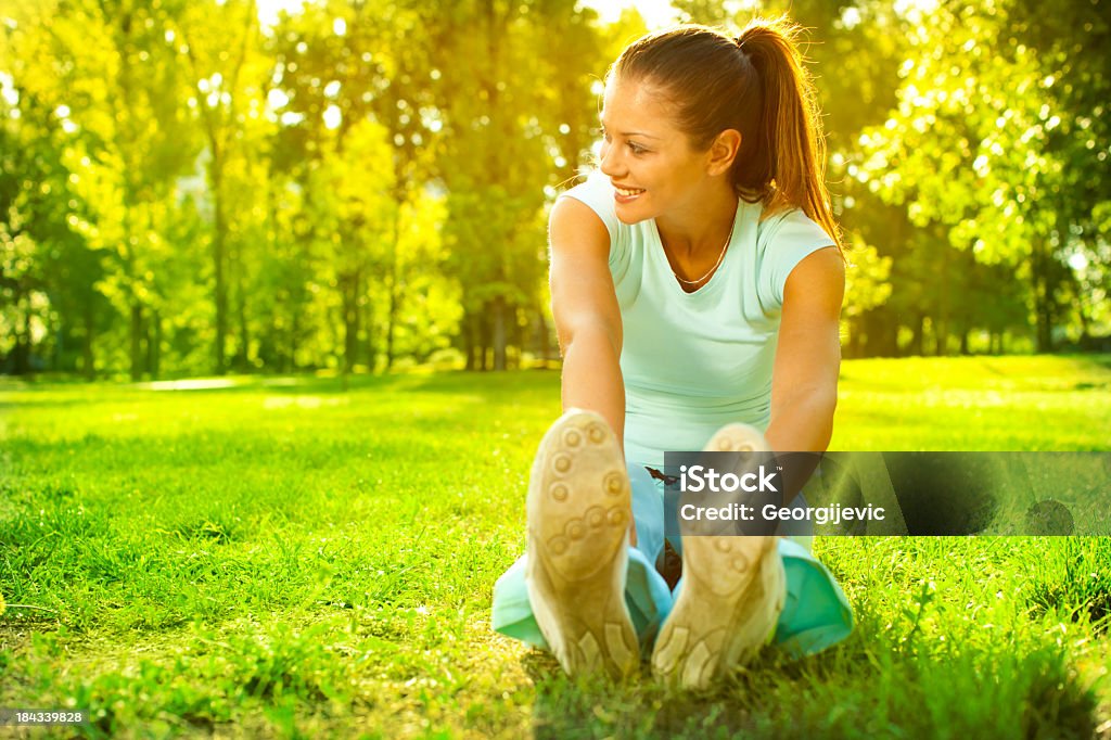 Fitness woman Young sporty woman doing fitness exercises outdoor. Active Lifestyle Stock Photo