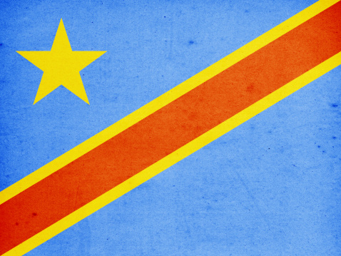 Close-up on a paper flag of Democratic Republic of the Congo (or Zaire) with light effect and vignette. Visible paper texture for super realistic effect. Selective focus. Canon 5D Mark II and Sigma lens.SEE MORE STATE FLAGS BELOW: