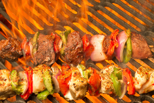 fresh beef and chicken kabobs on the bbq grill