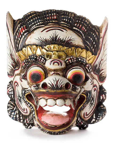 Photo of Balinese Hindu Barong mask isolated on a white background