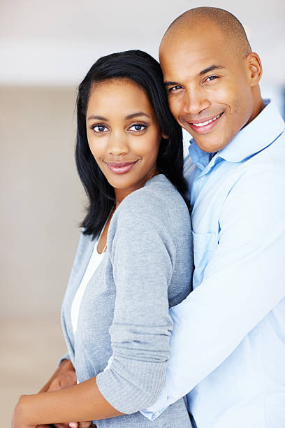 istock Young couple smiling together 184342157
