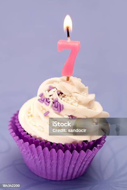Cupcake With A Number Seven Candle Stock Photo - Download Image Now - Cake, Number 7, Baked