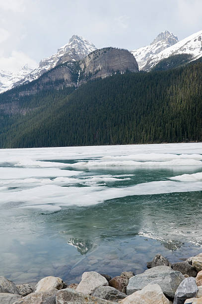 istock Lake louise reflection in ice with snow 184342301