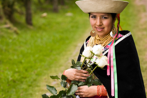 A young ecuadorian girl dressing tipycal clothes.