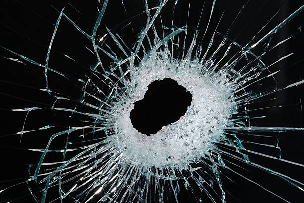 istock Hole in glass close up 184343068