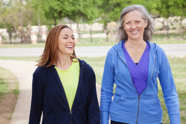 istock Mother Walking With Her Daughter While Exercising at Park 184343091
