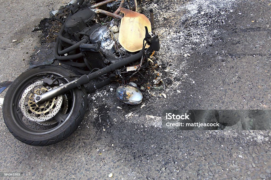 Burnt out Motorbike Remains of a burnt out motorbike Motorcycle Stock Photo