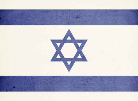Close-up on a paper flag of Israel with light effect and vignette. Visible paper texture for super realistic effect. Selective focus. Canon 5D Mark II and Sigma lens.SEE MORE STATE FLAGS BELOW: