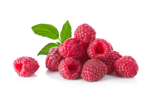 Composition of raspberries with a leaf on a white background.
