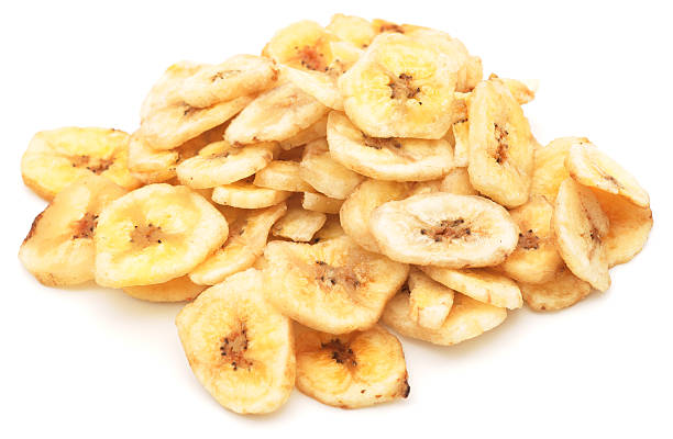 istock Dried banana chips pile isolated on white 184343933