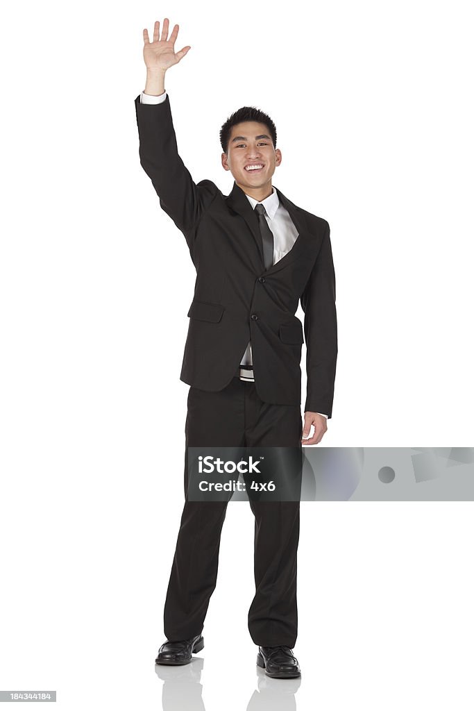Businessman waving his hand Businessman waving his handhttp://www.twodozendesign.info/i/1.png Asian and Indian Ethnicities Stock Photo