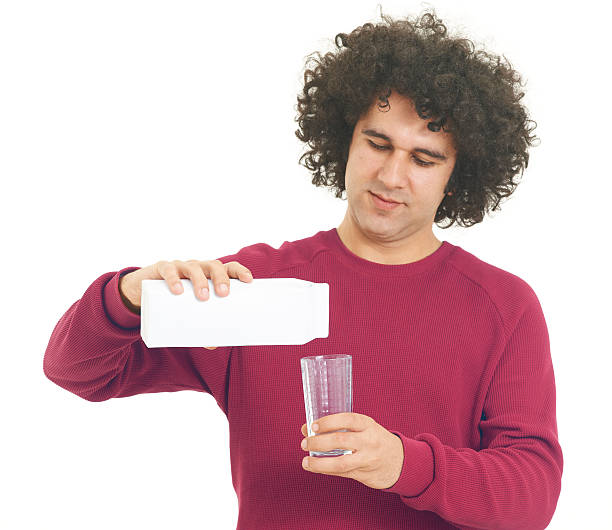 istock Young man holding a milk jug 184344320