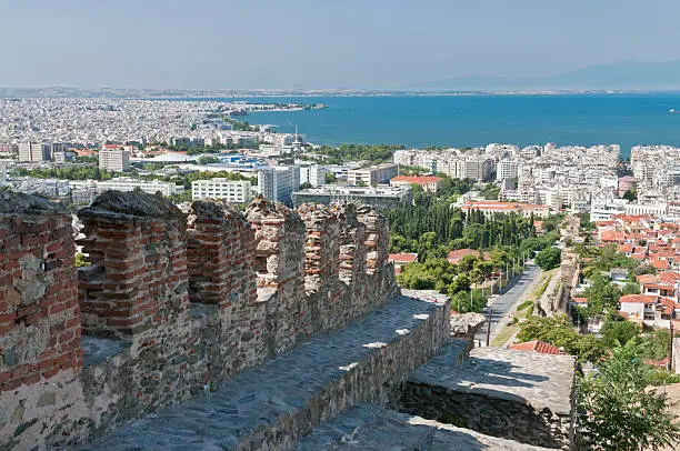 "Thessalonika, the second largest city of greece. In front the old city wall, in the background the aegean sea and mount olympus"