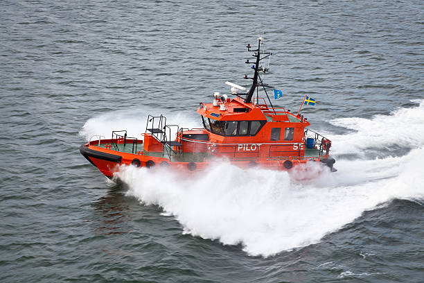 istock Fast orange and black pilot boat in Sweden sea 184344416