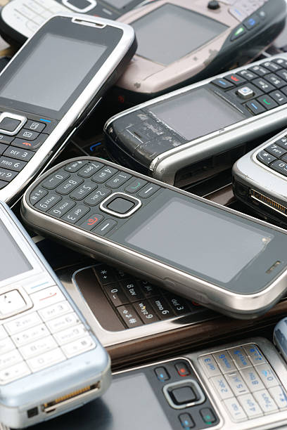 istock Old used cellphones pile as background - vertical 184344444