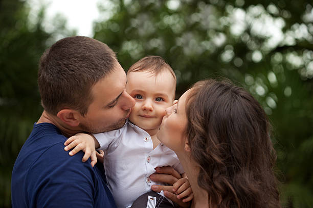 istock Young family having fun at the park 184344695