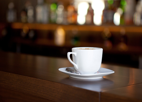 Close-up of white coffee cup on a table