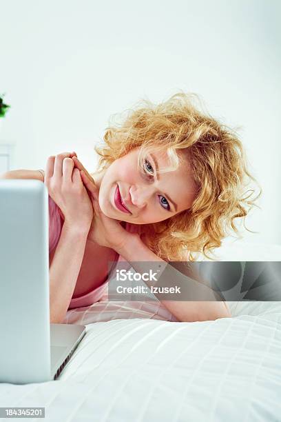 Using Computer In A Bed Stock Photo - Download Image Now - 25-29 Years, Adult, Adults Only
