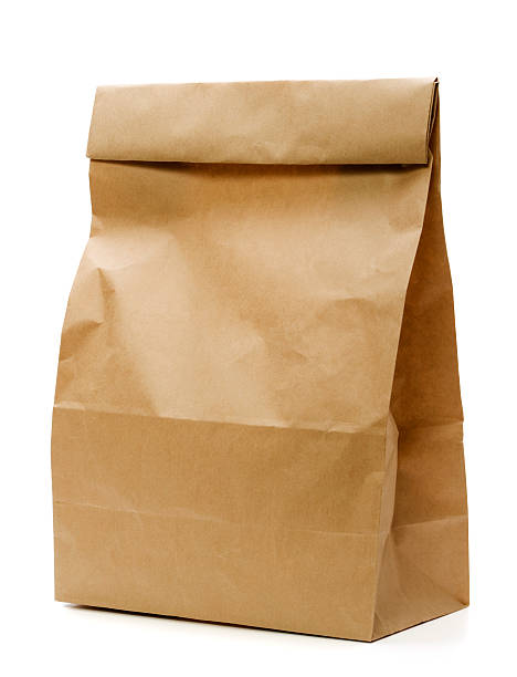 Brown Paper Bag Brown Paper Lunch Bag on white. packed lunch photos stock pictures, royalty-free photos & images