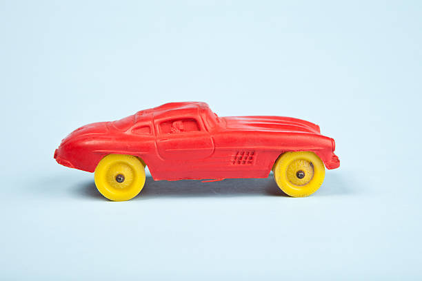 istock Vintage Red Plastic Car on Blue 184345445