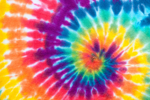 lebhafte tie dye - psychedelic funky yellow orange stock-fotos und bilder