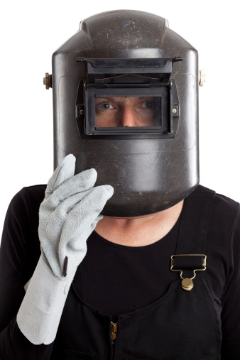 Imagen en blanco de cabeza de mujer usando la máscara de soldador photo