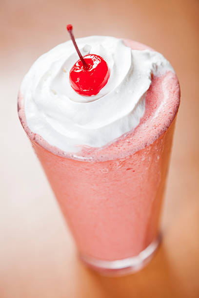 istock Classic glass of strawberry smoothie 184345884