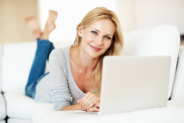 istock Relaxed woman working on laptop 184346081