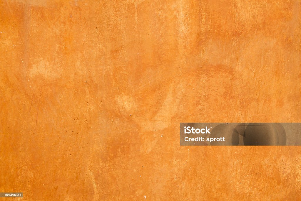 Grungy painted wall background Fullframe image of grungy orange painted wall background. Architectural Feature Stock Photo