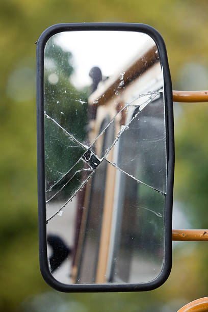 Damaged Side Mirror Damaged side mirror of an old pick up. broken side view mirror stock pictures, royalty-free photos & images