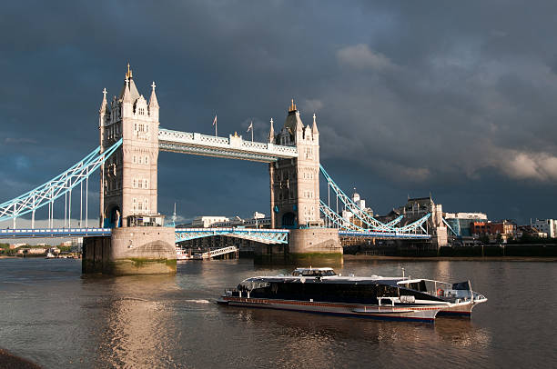 Tower Bridge and passenger boat, London stock photo