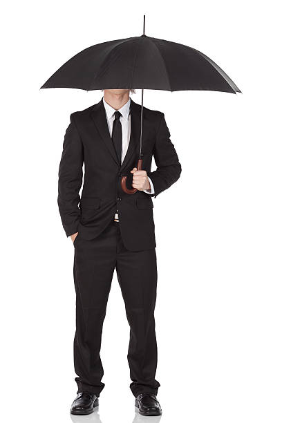 istock Businessman standing under an umbrella 184347619