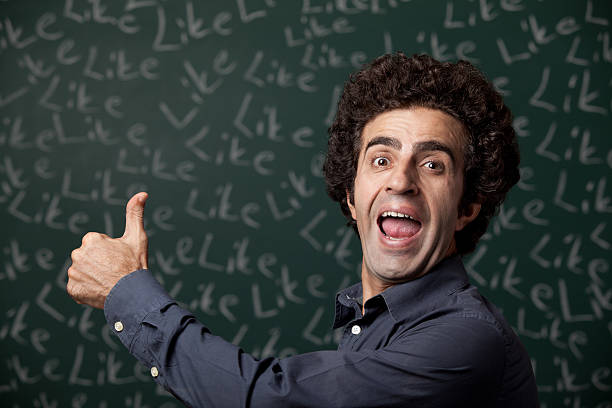 Thumbs up for "like" Thumbs up on blackboard with word like written on for social media celebrity endorsements stock pictures, royalty-free photos & images