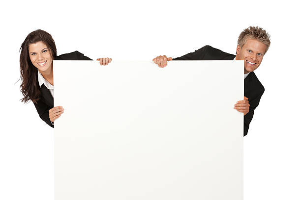 istock Business couple behind  a placard 184348156