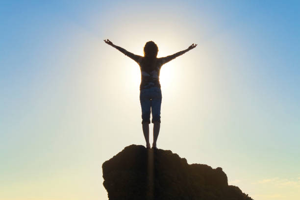 istock Woman Raising Arms In Hope 184348310
