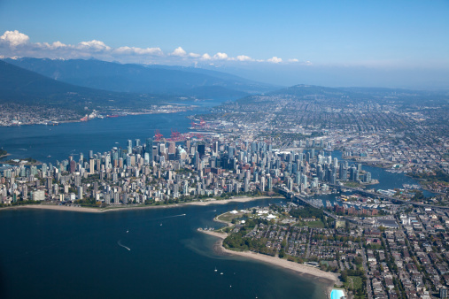 An aerial photo of downtown Vancouver viewed from over English Bay.