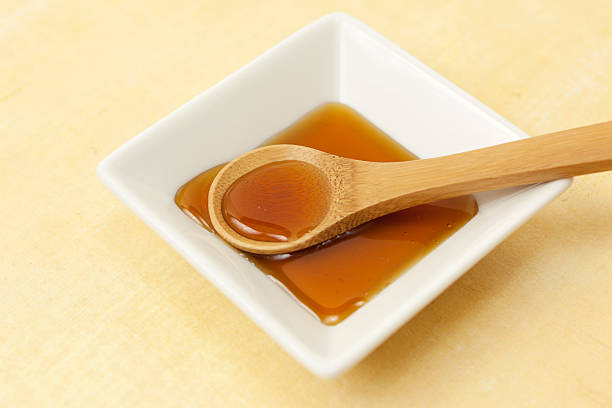 istock Honey on wooden spoon 184350276