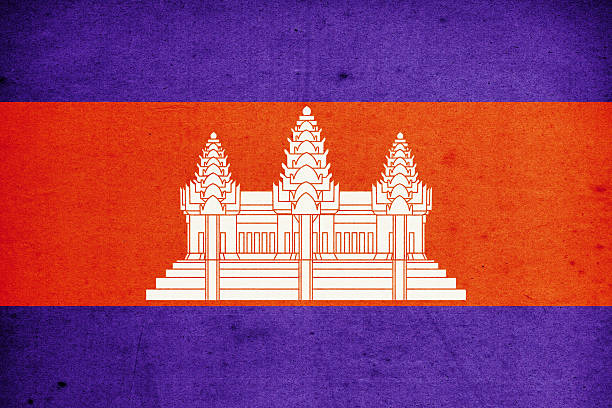 Small paper flag of Cambodia pinned. Isolated on white background. Horizontal orientation. Close up photography. Copy space.