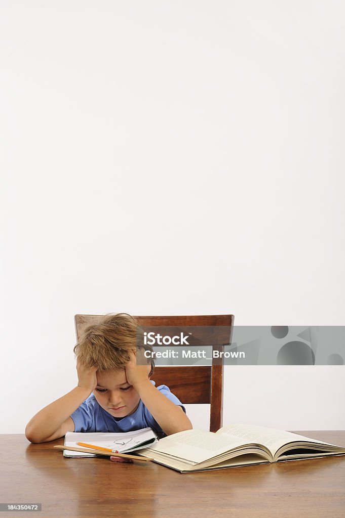 frustrated from studying Boy is frustrated with homework Adult Stock Photo