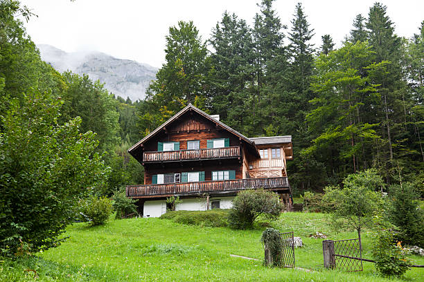 istock Wooden tree storey building in the Austrian alps 184350511