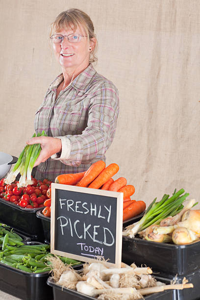 istock Pleasant Stallholder At A Farmers Market 184350557