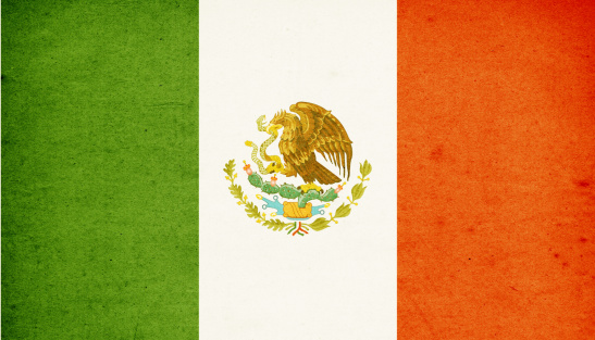 Close-up on a paper flag of Mexico with light effect and vignette. Visible paper texture for super realistic effect. Selective focus. Canon 5D Mark II and Sigma lens.SEE MORE STATE FLAGS BELOW:
