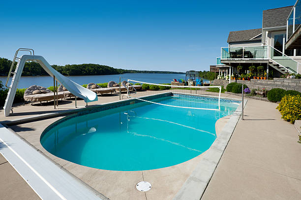 istock Luxury Swimming Pool With Waterfront View 184350678