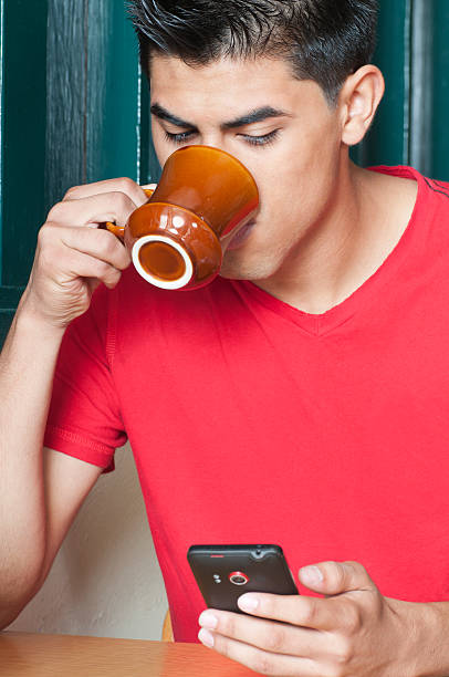 istock Guy With Coffee and Smart Phone 184350746